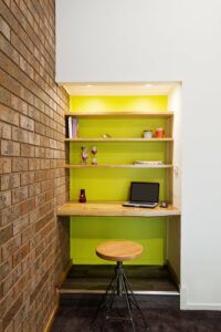 Lime green feature wall study nook in contemporary living room
