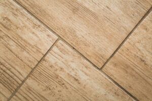 Close up of wood-like floor tile. Ceramic tile with wooden structure in close up - useful background.